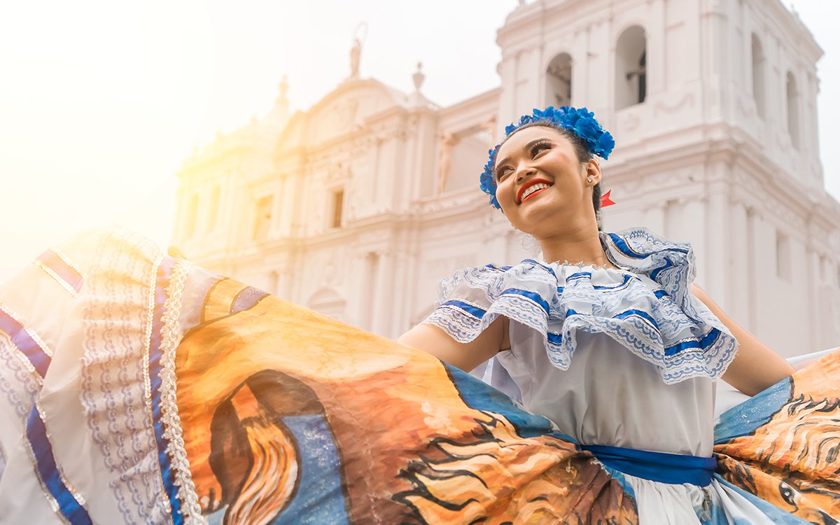 Traditional dancer with a typical Nicaraguan costume dancing outside the cathedral of Leon Nicaragua celebrating the independence